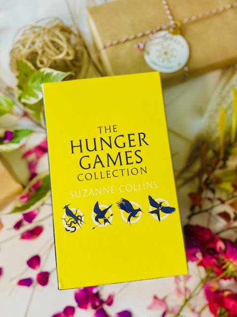 The Hunger Games by Suzanne Collins The Hunger Games by Suzanne Collins